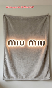 Miu Miu Glowing Logo Warm Beige Flannel Throw Blanket Miu Miu Neon Light Printed Sofa Blanket IMG_0386